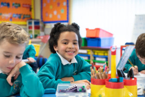 student smiling in classroom