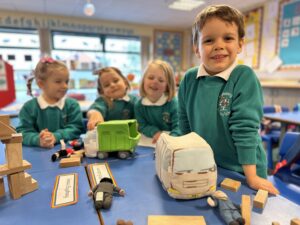 Class activity with smiling kids around a table